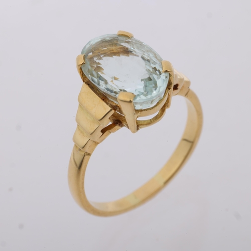 1254 - A late 20th century solitaire aquamarine dress ring, claw set with 4.25ct oval mixed-cut aquamarine,... 