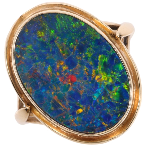 1256 - A late 20th century black opal doublet dress ring, apparently unmarked Continental gold settings, se... 