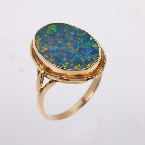 1256 - A late 20th century black opal doublet dress ring, apparently unmarked Continental gold settings, se... 