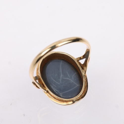 1256 - A late 20th century black opal doublet dress ring, apparently unmarked Continental gold settings, se... 