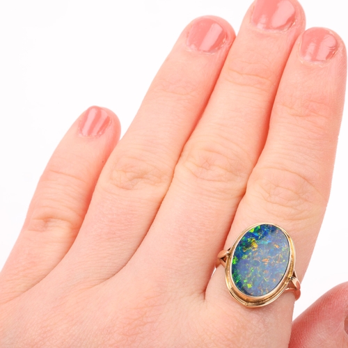 1256 - A late 20th century black opal doublet dress ring, apparently unmarked Continental gold settings, se... 