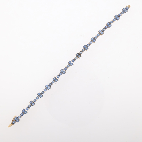 1273 - A modern 9ct gold sapphire tennis line bracelet, Birmingham 2005, set with oval mixed-cut sapphires,... 