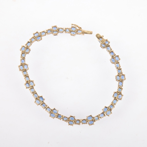 1273 - A modern 9ct gold sapphire tennis line bracelet, Birmingham 2005, set with oval mixed-cut sapphires,... 