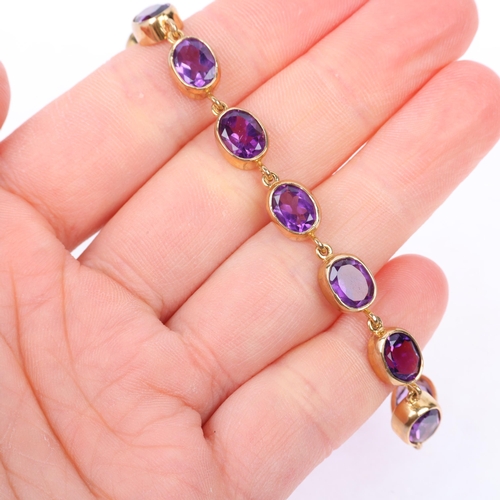 1276 - A modern 9ct gold amethyst tennis line bracelet, rub-over set with oval mixed-cut amethysts, 19cm, 1... 