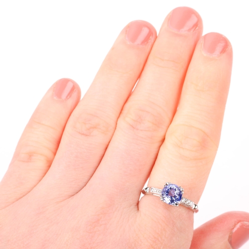 1277 - A modern tanzanite and diamond dress ring, set with round-cut tanzanite and modern round brilliant-c... 