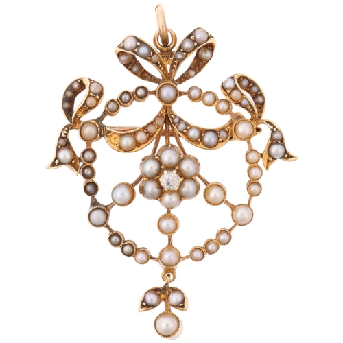 1279 - An Edwardian 15ct gold split pearl and diamond openwork ribbon pendant/brooch, 38.5mm, 6g