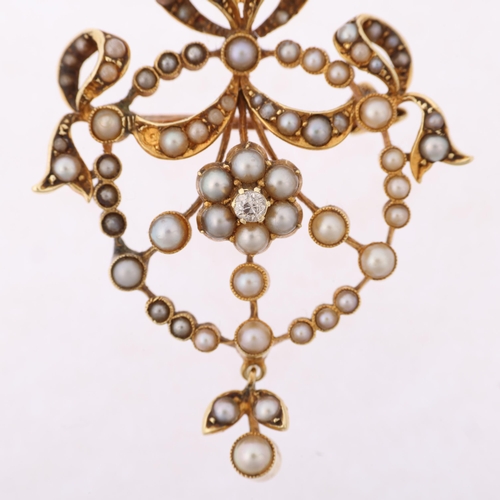 1279 - An Edwardian 15ct gold split pearl and diamond openwork ribbon pendant/brooch, 38.5mm, 6g