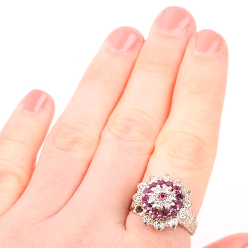 1283 - A late 20th century 18ct white gold ruby and diamond flowerhead cluster ring, maker J Ltd, London 19... 