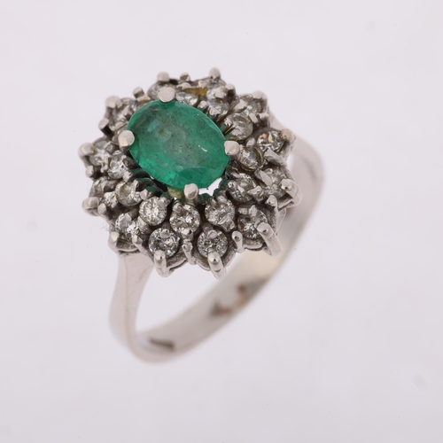 1290 - A Continental 18ct white gold emerald and diamond flowerhead cluster ring, claw set with oval mixed-... 