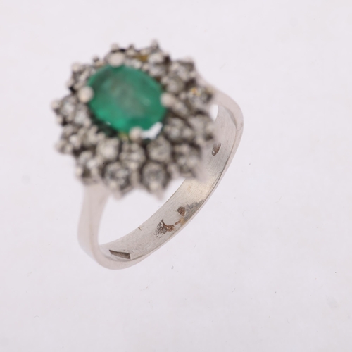 1290 - A Continental 18ct white gold emerald and diamond flowerhead cluster ring, claw set with oval mixed-... 