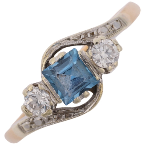 1293 - An Art Deco 9ct gold three stone blue topaz and diamond crossover ring, platinum-topped set with squ... 