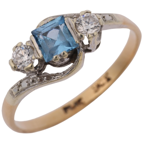 1293 - An Art Deco 9ct gold three stone blue topaz and diamond crossover ring, platinum-topped set with squ... 