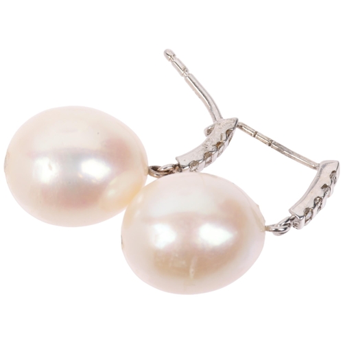 1297 - A pair of 9ct white gold whole pearl and diamond drop earrings, with stud fittings, 25.5mm, 6.5g