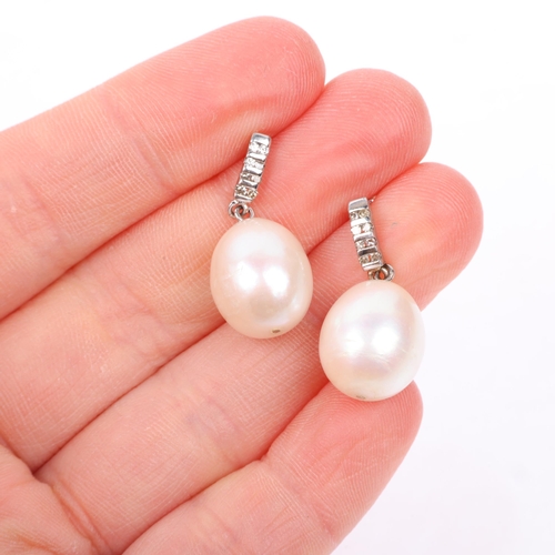 1297 - A pair of 9ct white gold whole pearl and diamond drop earrings, with stud fittings, 25.5mm, 6.5g