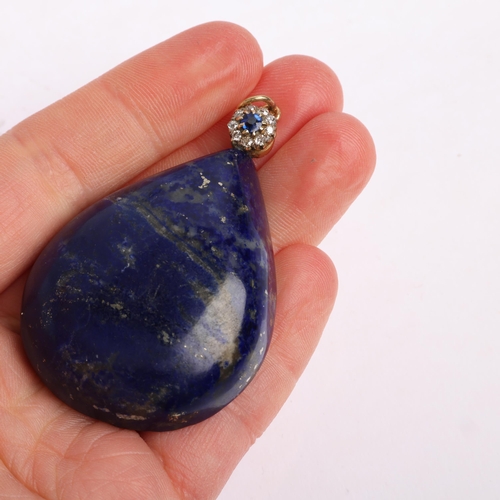 1310 - A large Vintage lapis lazuli sapphire and diamond flowerhead cluster pendant, set with pear cabochon... 