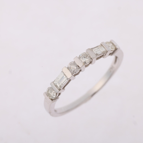 1313 - A modern 14ct white gold diamond half hoop ring, set with modern round brilliant and baguette-cut di... 