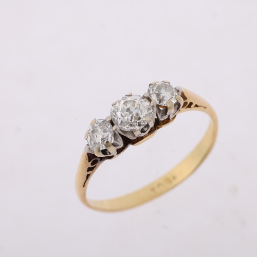 1314 - An early 20th century 18ct gold three stone diamond ring, claw set with old European-cut diamonds, t... 