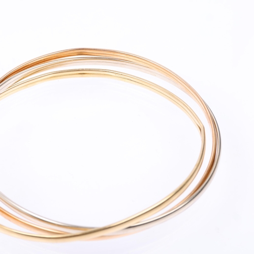 1326 - An Italian 18ct three-colour gold 'Trinity Style' triple bangle, individual band width 3mm, internal... 