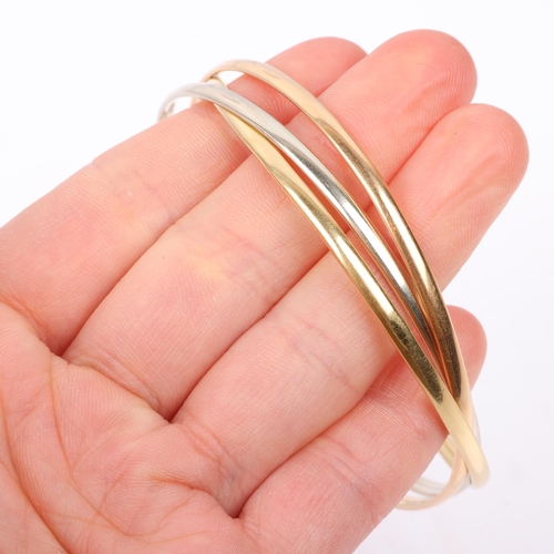 1326 - An Italian 18ct three-colour gold 'Trinity Style' triple bangle, individual band width 3mm, internal... 