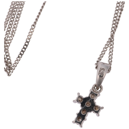 1329 - A modern 9ct white gold diamond cross pendant necklace, on 9ct white gold fine curb link chain, pend... 