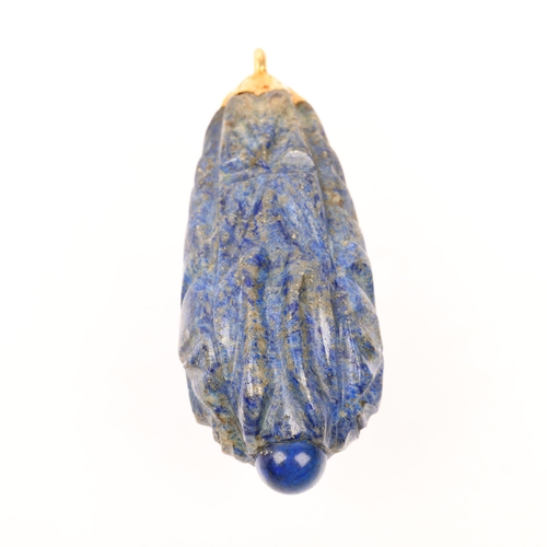 1371 - A large Ethnic carved lapis lazuli idol head teardrop pendant, with unmarked yellow metal mount, 69.... 