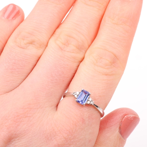 1372 - A modern 18ct white gold tanzanite and diamond dress ring, setting height 6.4mm, size M, 1.6g