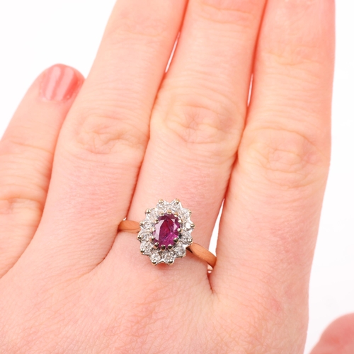 1377 - A late 20th century 9ct gold ruby and diamond oval cluster ring, maker MM Ltd, London 1983, setting ... 