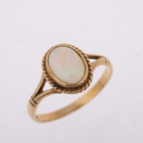 1392 - A late 20th century 9ct gold opal dress ring, maker S&S, Birmingham 1995, rub-over set with oval cab... 