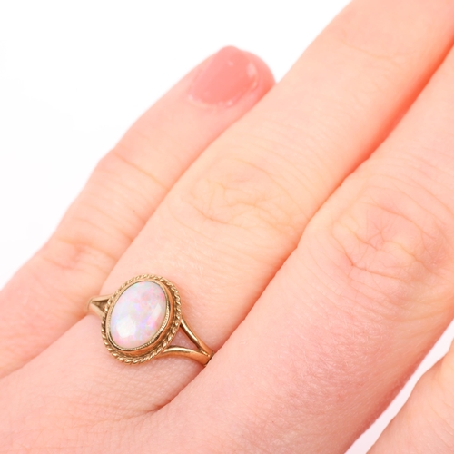 1392 - A late 20th century 9ct gold opal dress ring, maker S&S, Birmingham 1995, rub-over set with oval cab... 