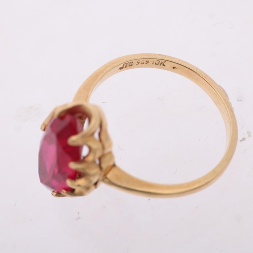 1399 - A 9ct gold synthetic ruby dress ring, set with marquise-cut synthetic ruby setting height 15.8mm, si... 