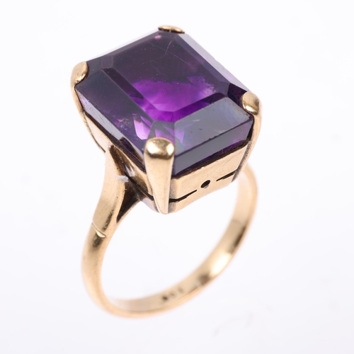 1402 - A mid-20th century 9ct gold amethyst dress ring, claw set with emerald step-cut amethyst, setting he... 