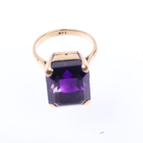 1402 - A mid-20th century 9ct gold amethyst dress ring, claw set with emerald step-cut amethyst, setting he... 