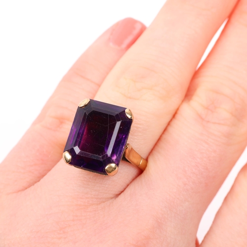 1402 - A mid-20th century 9ct gold amethyst dress ring, claw set with emerald step-cut amethyst, setting he... 