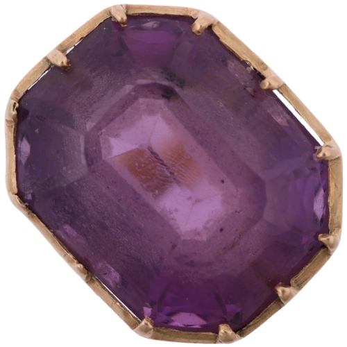 1403 - A mid-20th century amethyst dress ring, collet set with emerald step-cut amethyst, apparently unmark... 