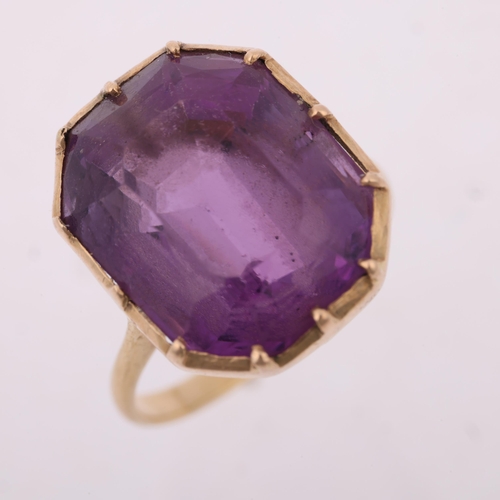 1403 - A mid-20th century amethyst dress ring, collet set with emerald step-cut amethyst, apparently unmark... 