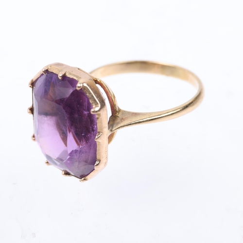 1403 - A mid-20th century amethyst dress ring, collet set with emerald step-cut amethyst, apparently unmark... 