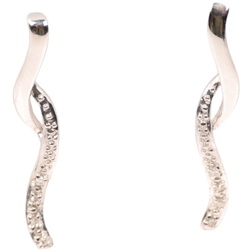 1405 - A pair of 9ct white gold diamond ribbon earrings, with stud fittings, set with eight-cut diamonds, 2... 