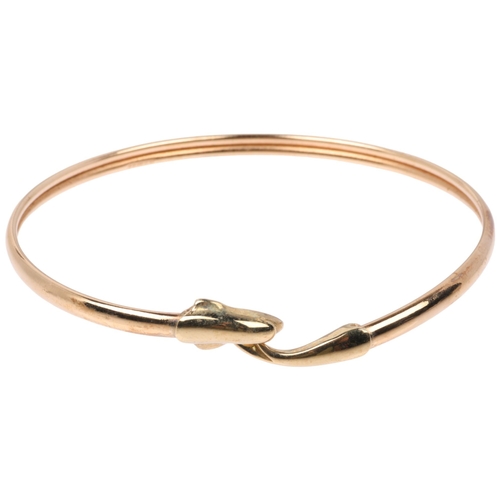 1406 - A late 20th century 9ct gold dolphin torque bangle, maker CJ Ltd, Birmingham 1993, band width 3.6mm,... 