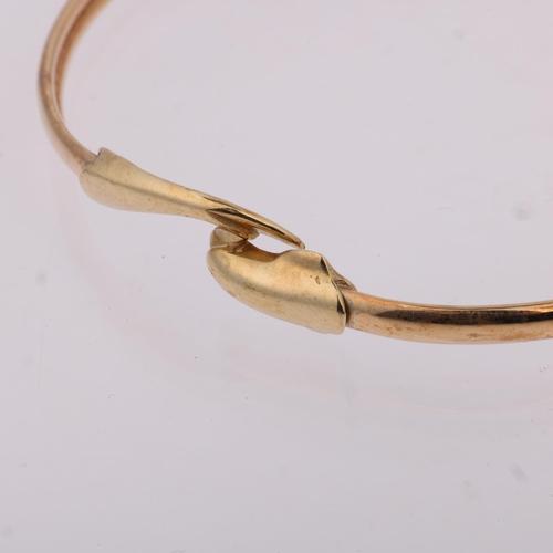 1406 - A late 20th century 9ct gold dolphin torque bangle, maker CJ Ltd, Birmingham 1993, band width 3.6mm,... 