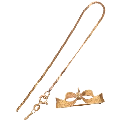 1416 - A 9ct gold ribbon bow brooch, 31.8mm, and a 9ct gold spiga link chain bracelet (A/F), 3.3g total (2)