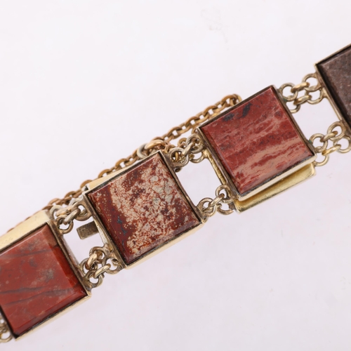 1431 - A Russian silver-gilt jasper panel bracelet, each panel set with polished square step-cut jasper, ba... 