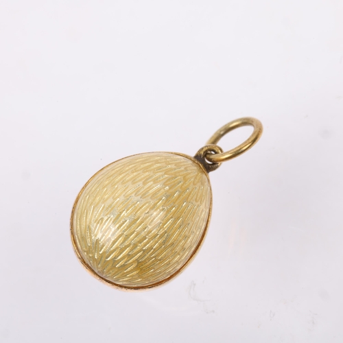 1432 - A Vintage enamel rose egg pendant, gilt-metal frame, 19.2mm, 3.9g