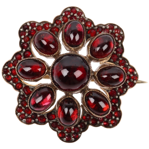 1439 - A Victorian Bohemian garnet flowerhead cluster brooch, set with round and oval cabochon garnet flowe... 