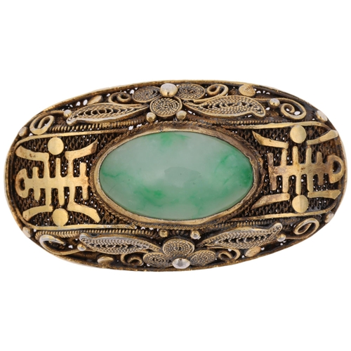 1441 - A Chinese silver-gilt jade bombe brooch, oval form with applied character marks on filigree wirework... 