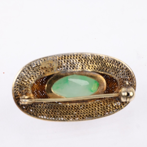 1441 - A Chinese silver-gilt jade bombe brooch, oval form with applied character marks on filigree wirework... 