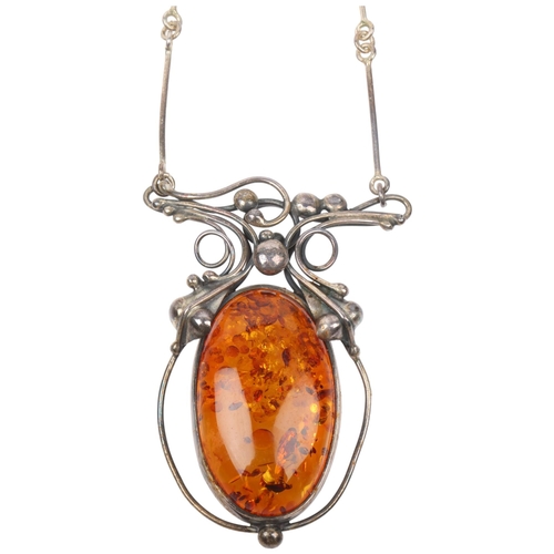 1442 - A large Art Nouveau style sterling silver and amber openwork pendant necklace, with integral sterlin... 