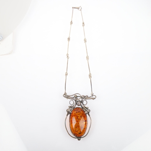 1442 - A large Art Nouveau style sterling silver and amber openwork pendant necklace, with integral sterlin... 