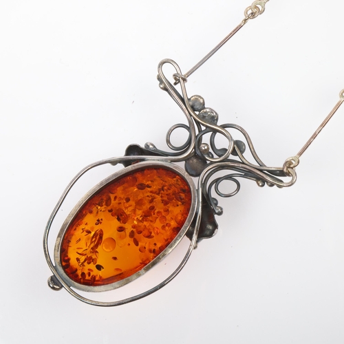 1442 - A large Art Nouveau style sterling silver and amber openwork pendant necklace, with integral sterlin... 