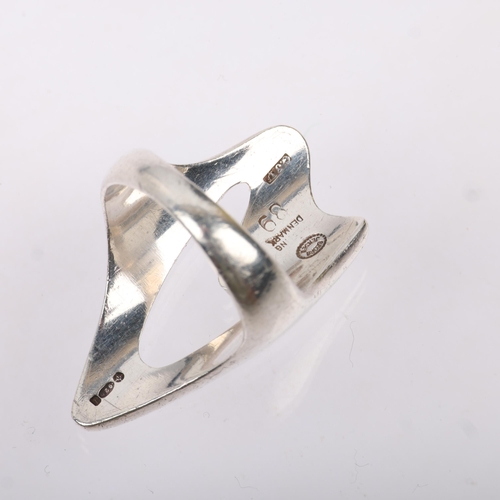 1460 - GEORG JENSEN - a Danish modernist sterling silver abstract openwork ring, designed by Henning Koppel... 