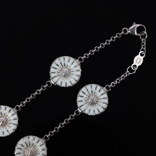 1471 - GEORG JENSEN - a modern Danish sterling silver and white enamel daisy pattern bracelet, designed by ... 